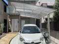ナチュラルな外構に優しく馴染むアール屋根のカーポート