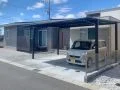 グレートーンの外壁に調和するシンプルモダンな新築外構