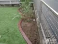 滑らかな曲線がナチュラルな印象の植栽スペース