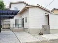 お住まいの個性を表現する大きなタイル門柱が印象的な新築外構