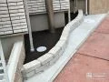ホワイトカラーのレンガを用い可愛らしい印象の植栽スペース