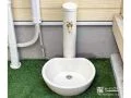 砂岩模様が上品な丸型タイプの立水栓