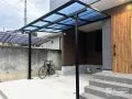 バルコニーの下に重なり合うようにテラス屋根を設置した工事