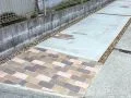 サビ砂利とレンガのブラウンカラーが温かい印象を演出した工事