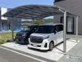 カーブを描く屋根が柔らかい印象でお車を守るカーポート設置工事