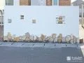 既存の門塀と門柱をホワイトカラーの塗装で生まれ変わらせた工事