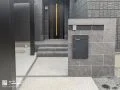 落ち着いたグレーの濃淡で仕上げたタイル貼りの門柱