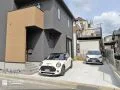 さりげないロックガーデンが引き立つナチュラルテイストの新築外構