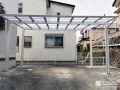 白壁の機能門柱とカーポートが調和するシンプルなリフォーム工事