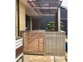木目調のフェンスと門扉で優しく囲うテラス屋根周りの工事