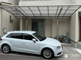 カーポートとアプローチを調和させた機能的で美しい外構工事
