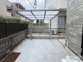 明るいカラーのタイルですっきり整った印象のお庭リフォーム工事