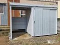 自転車の収納や作業に使えるスペースがついた便利な物置設置工事