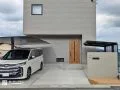 住まいと外構がリンクした落ち着きあるグレージュの新築外構