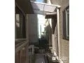 勝手口前にテラス屋根を設置し便利に活用できる空間に整えた工事