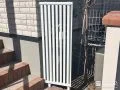 明るく軽やかな印象を与えるホワイト縦格子フェンスの設置工事