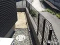 ブラックのメッシュフェンスで境界を明確化したリフォーム工事