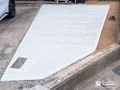 駐車スペースの一画にコンクリートを打ち雑草対策をした工事