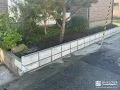 植栽スペースと道路の境界をブロックを積んで区切った工事