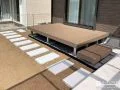 コンクリート平板がアクセントになったデッキ付きのお庭工事