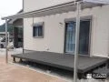 テラス屋根付きで洗濯物干し等の家事に便利なデッキの設置工事