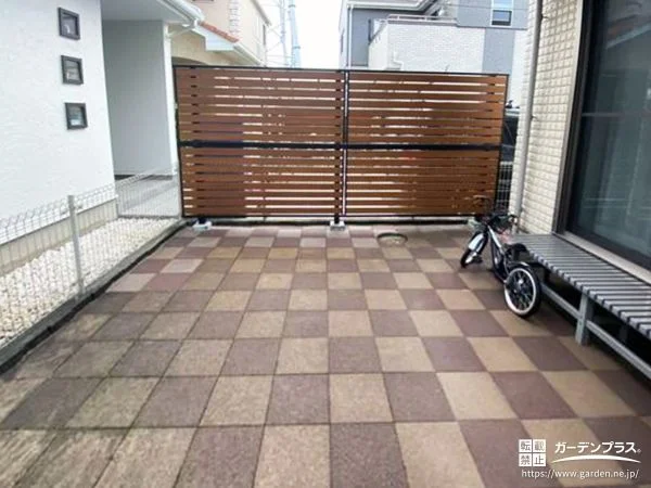 2色使いで動きのあるデザインに仕上げたインターロッキング工事