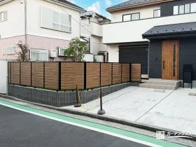 駐車スペースを家族の庭へ変えるフェンス付き外構リフォーム工事