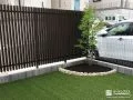 縦格子フェンスと御影石の花壇がモダンな雰囲気なお庭工事
