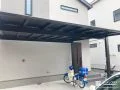 ブラックマットカラーが引き締める2台用カーポート設置工事