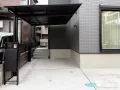 ブラックマット屋根のカーポートで引き締めるモダンな外構工事
