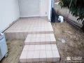 お庭との段差をゆるやかにつなぐタイルデッキを設置した工事