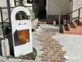 曲線を描くピンコロ目地と素材感で彩るナチュラルな新築外構工事
