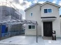 ワイドタイプのカーポートと門柱で機能的に整えた外構工事