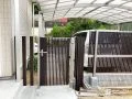 縦格子の木調デザインフェンスと門扉を組合わせたお庭入り口工事