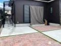 インターロッキングと芝目地で彩った遊び心ある駐車スペース工事