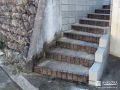 階段脇に土留めを設けすっきりと空間を区切ったリフォーム工事
