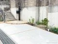 乱形石のアプローチとレンガ目地が玄関前を彩るファサード工事
