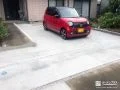 雑草が生い茂った前庭を駐車スペースへ一新したコンクリート工事