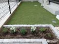 人工芝と花壇で緑あふれるメンテナンスしやすいお庭にした工事