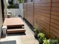 木目の目隠しでくつろぎ感を高めたプライベートデッキ空間工事