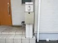 木調の機能門柱とピンコロ石目地がさりげない彩りを添えた工事