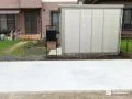 木調の機能門柱をアクセントに広々とした駐車空間を整えた工事