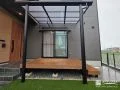 家族のくつろぎ空間をつくるウッドデッキとテラス屋根