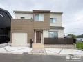 木目調カラーを重ねてお住まいとの一体感を高めた外構工事
