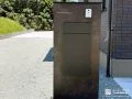 重厚感のある門柱に宅配ボックスをまとめ玄スマートに整えた工事