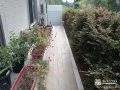 お庭の植栽とも調和した犬走りレンガ舗装工事